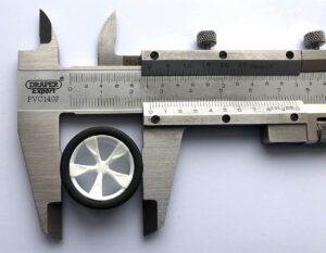 Using a calliper to measure the size of a Mini 4WD wheel